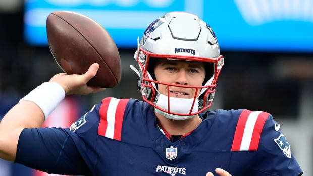 Patriots quarterback Mac Jones warms up before a game.